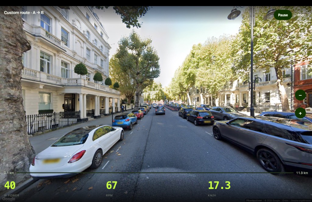 Indoor cycling on neighborhood road in Google Street View with trainer metrics
